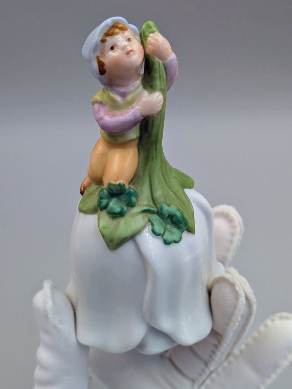 Vintage 1983 Avon Good Luck Bell - Porcelain Pixie Elf on White Flower